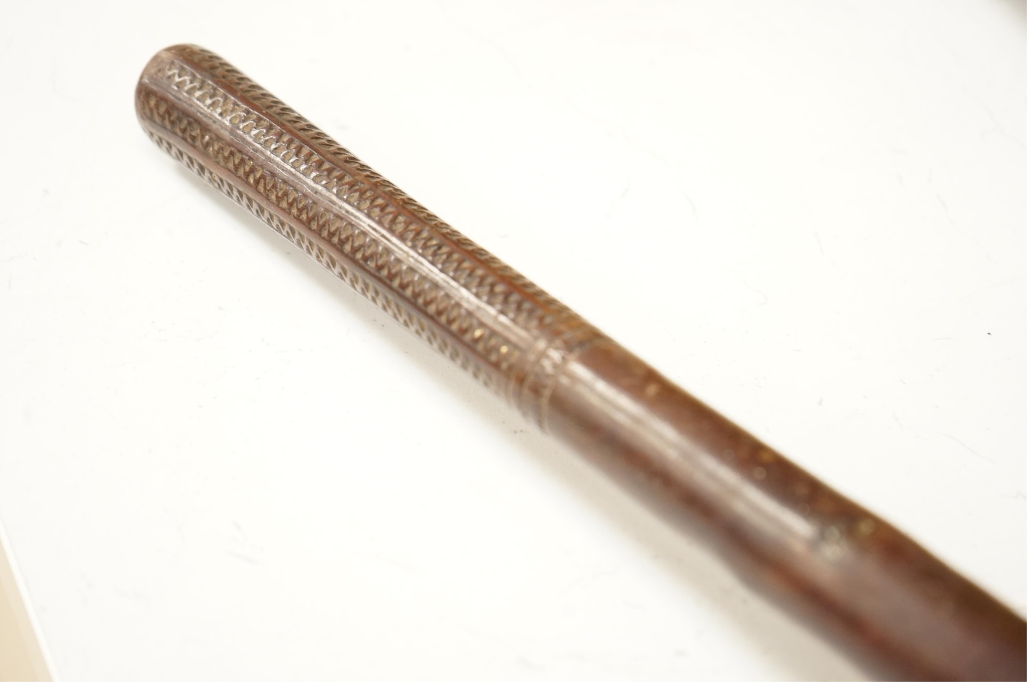 An African tribal knobkerrie with incised decoration to the handle